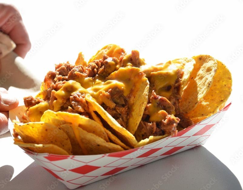 Guests lining up at a taco bar at a catered party